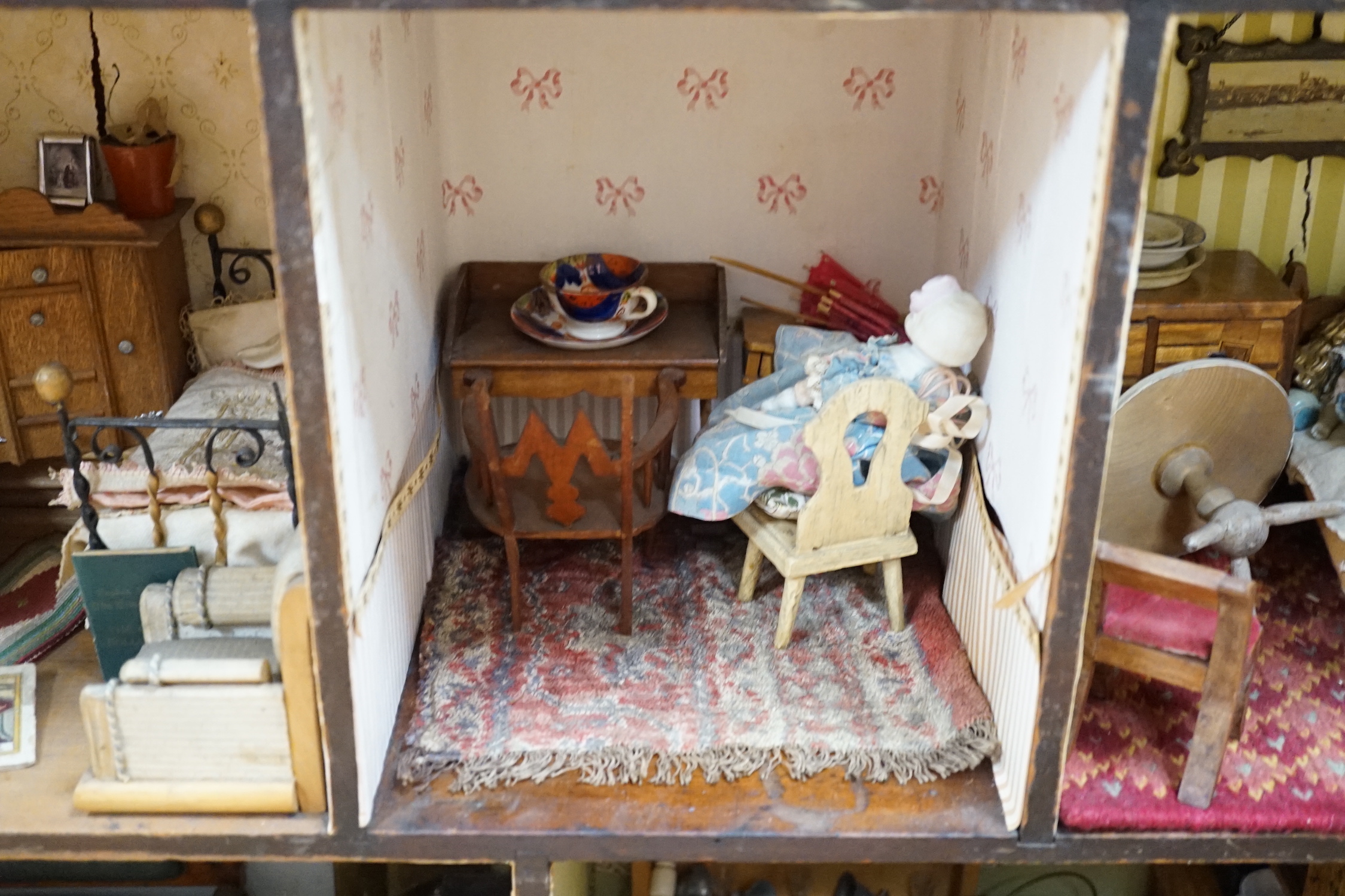 A furnished English dolls’ house, circa 1810-20, 104cm high